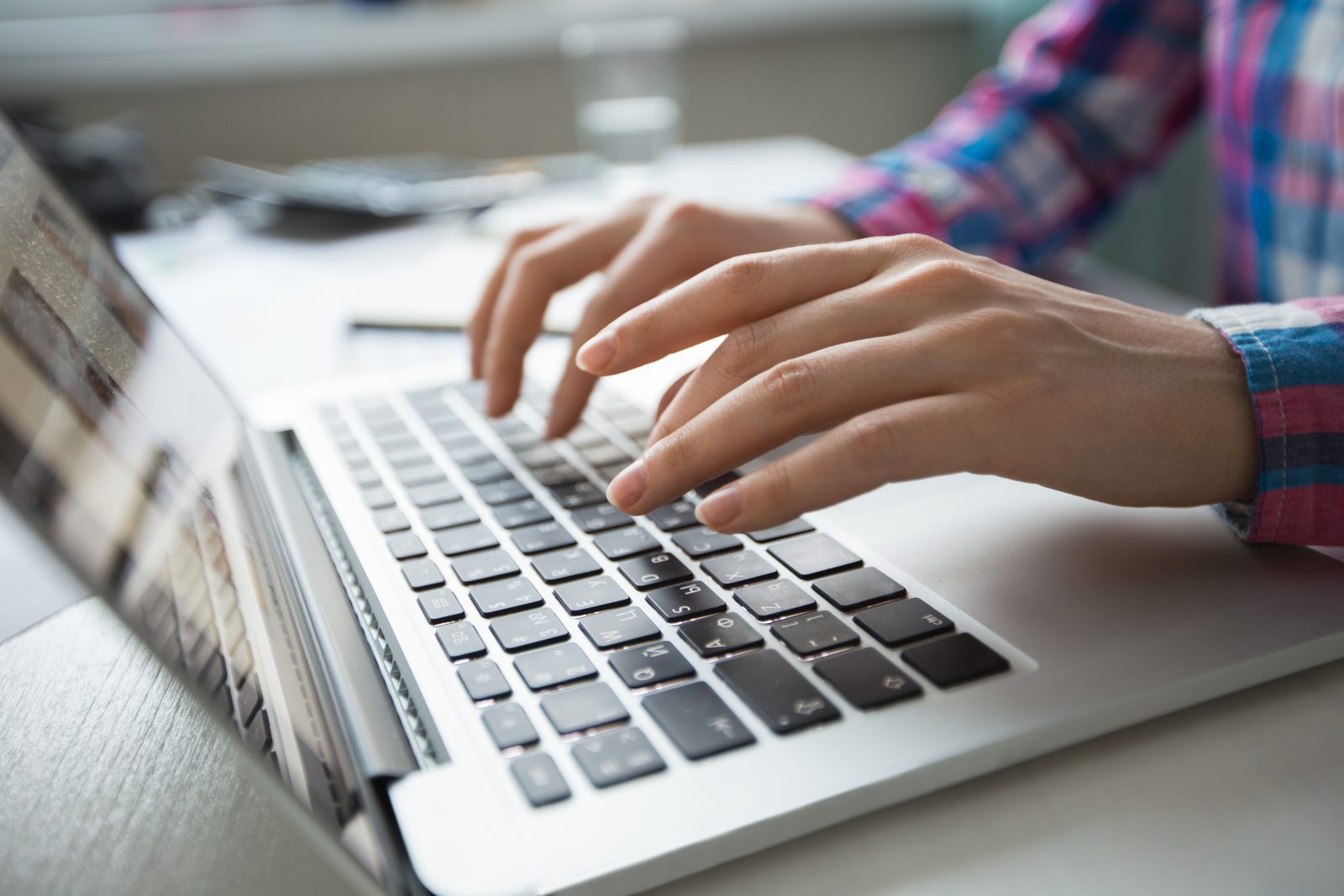 cropped-view-of-hands-typing-on-laptop(1)