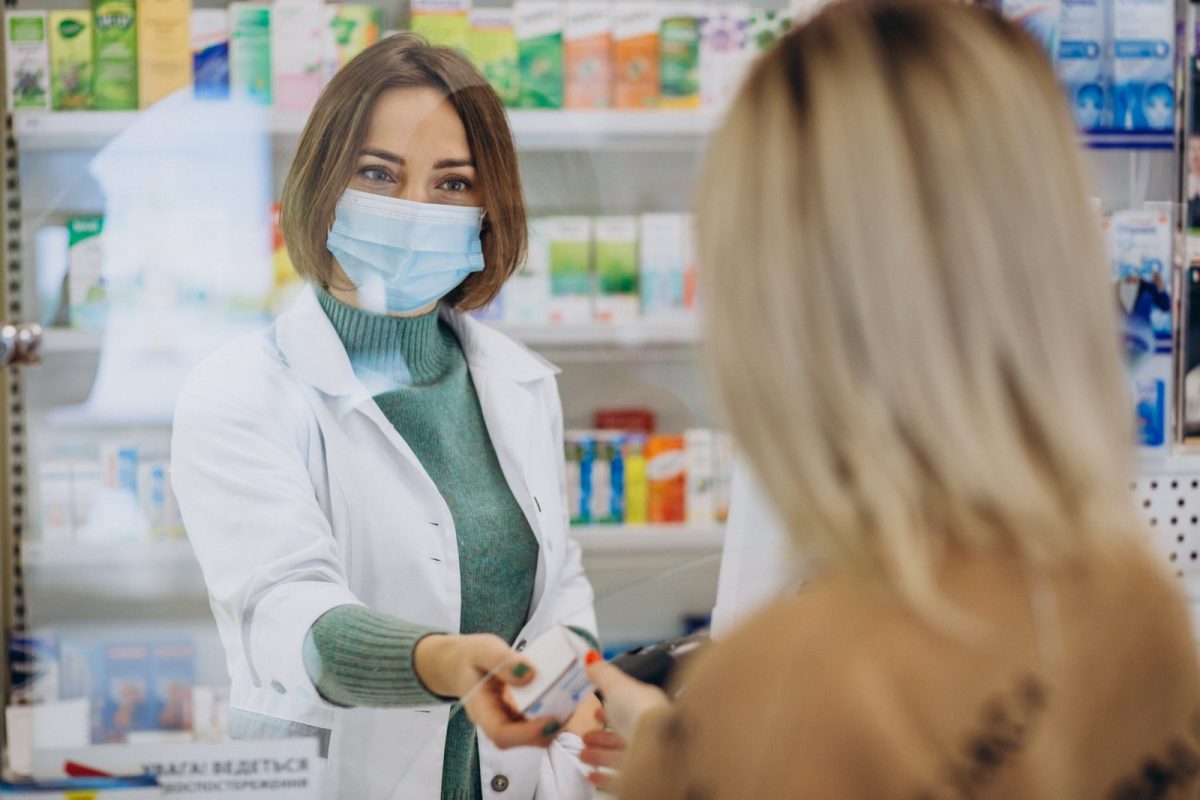 pharmasict-serving-customer-at-drug-store