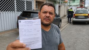 multa estacionar na garagem morador carro agente de trânsito