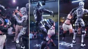 Luta entre humano e robô: montagem mostra influenciador de capacete diante de robô humanoide prateado em arena da REK
