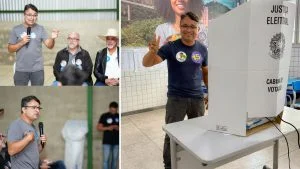 Vandinho Leite, deputado estadual do MDB, faz sinal de vitória ao lado da cabine de votação da Justiça Eleitoral
